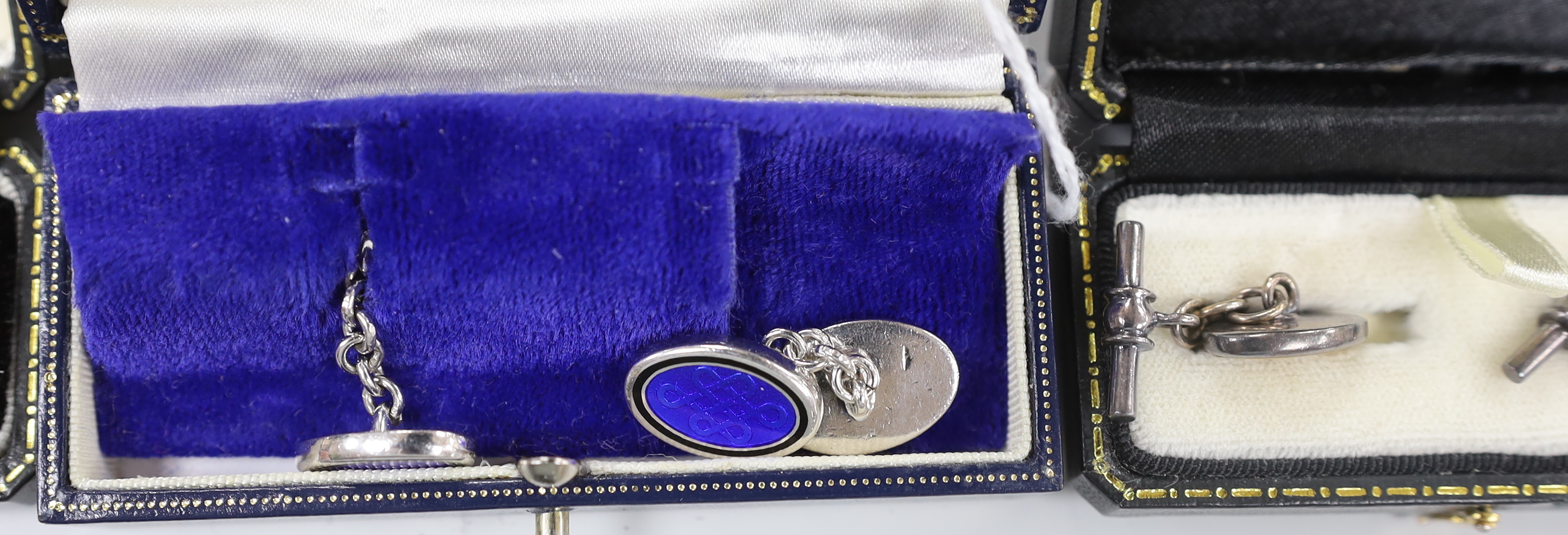 Four pairs of modern cufflinks including 925 and blue guilloche enamel and 925 and carnelian and two other white metal, set with tiger's eye quartz or mother of pearl.